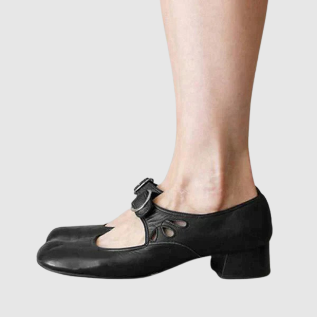 Woman modelling easy-wear shoes against a plain background.