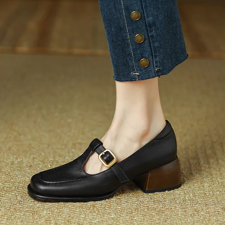 Woman wearing smart casual square toe shoes with a secure strap.