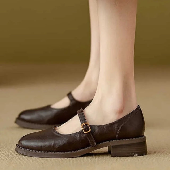 Classic Mary Jane shoes shown on a plain background with round toe styling.