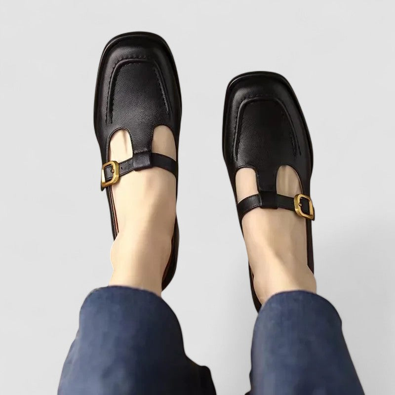 Female Mary Jane shoes shown on a plain background with rounded toe styling.