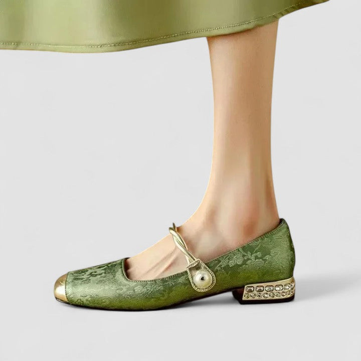 Female wearing comfortable strap shoes on a plain background.