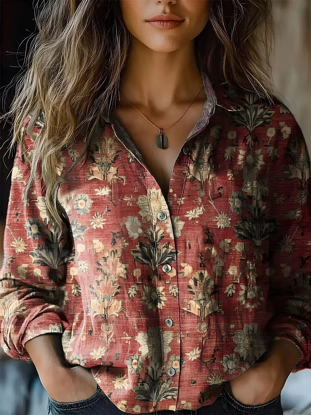  Female wearing a vintage-inspired long sleeve shirt against a plain background.
