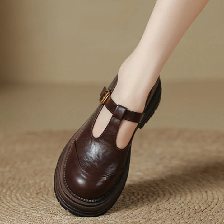 Women’s pointed toe block heel pumps on a plain background.