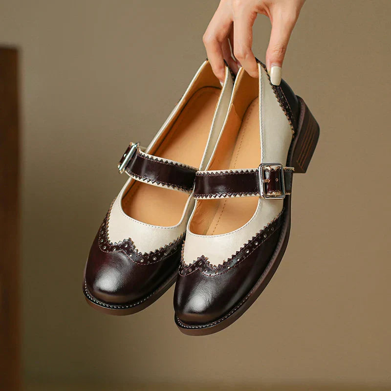Vintage-style Mary Jane flats on a plain background.