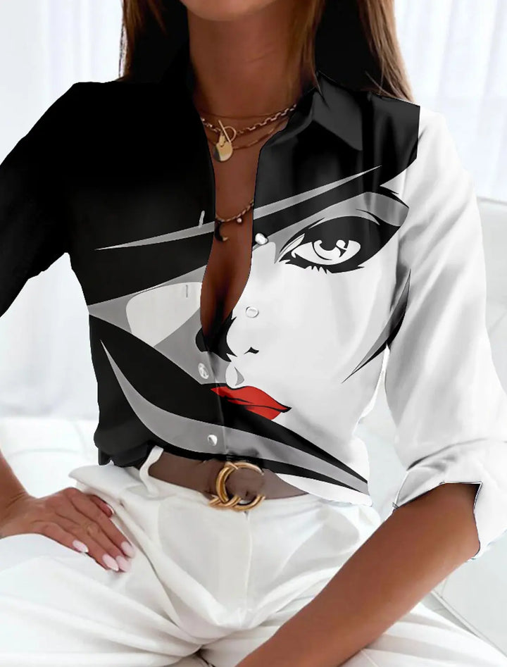  Woman in a long sleeve abstract pattern blouse on a plain background.