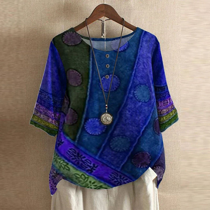 A relaxed floral blouse with long sleeves and a timeless look.X