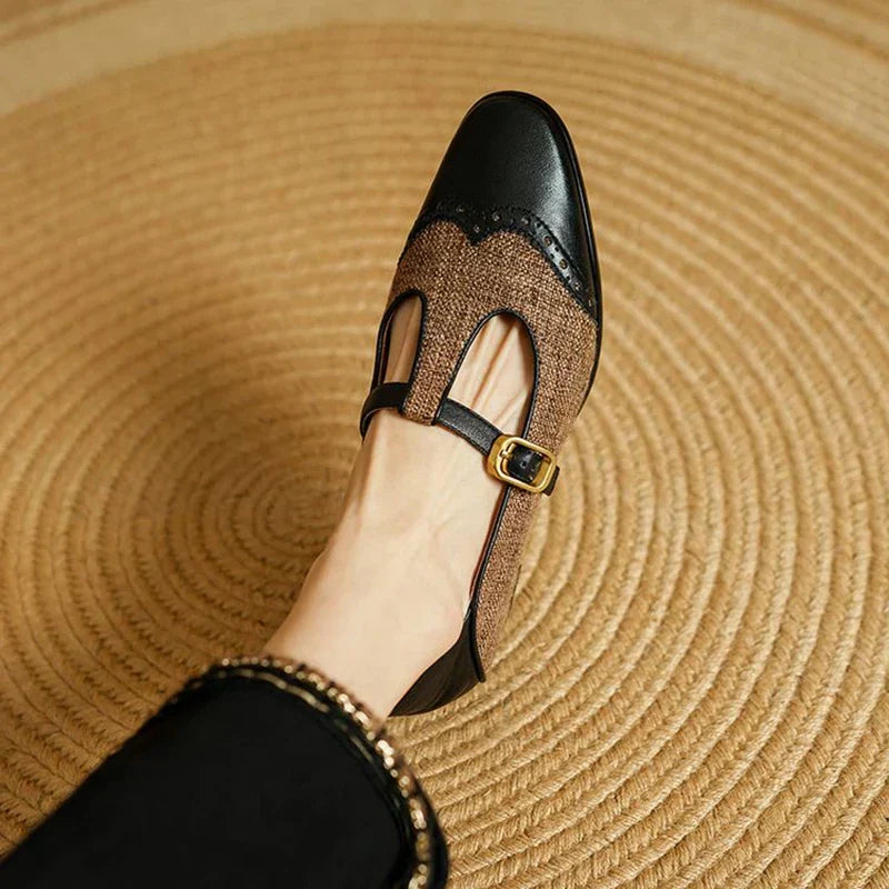 Woman modelling vintage-inspired Mary Jane shoes with a low block heel on a plain background.