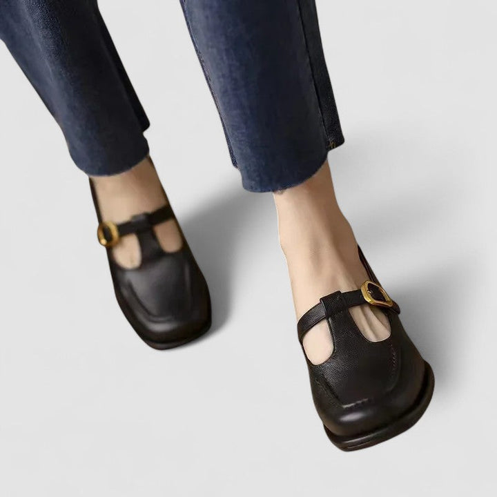 Female everyday shoes shown on a plain background with a neat strap detail.