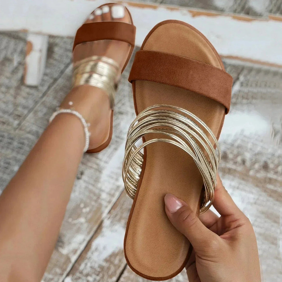 Female model showing lightweight slide sandals on a plain background.