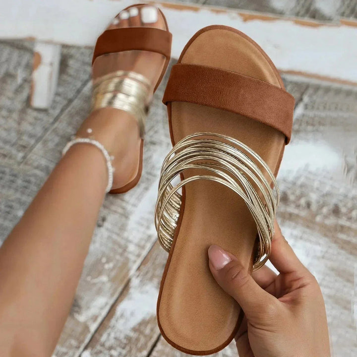 Female model showing lightweight slide sandals on a plain background.