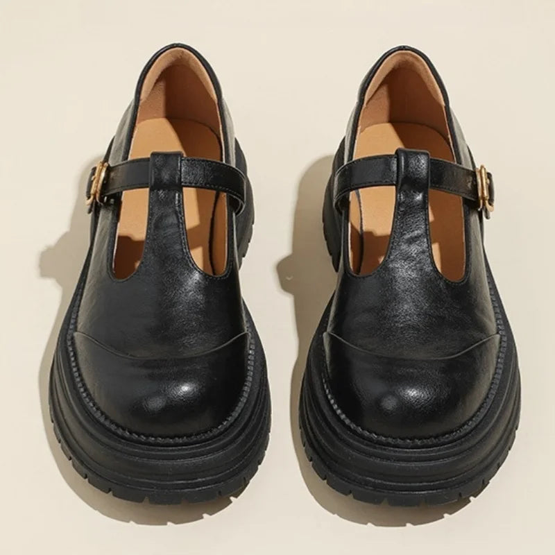 Slip-on heels with a smooth finish on a plain background.
