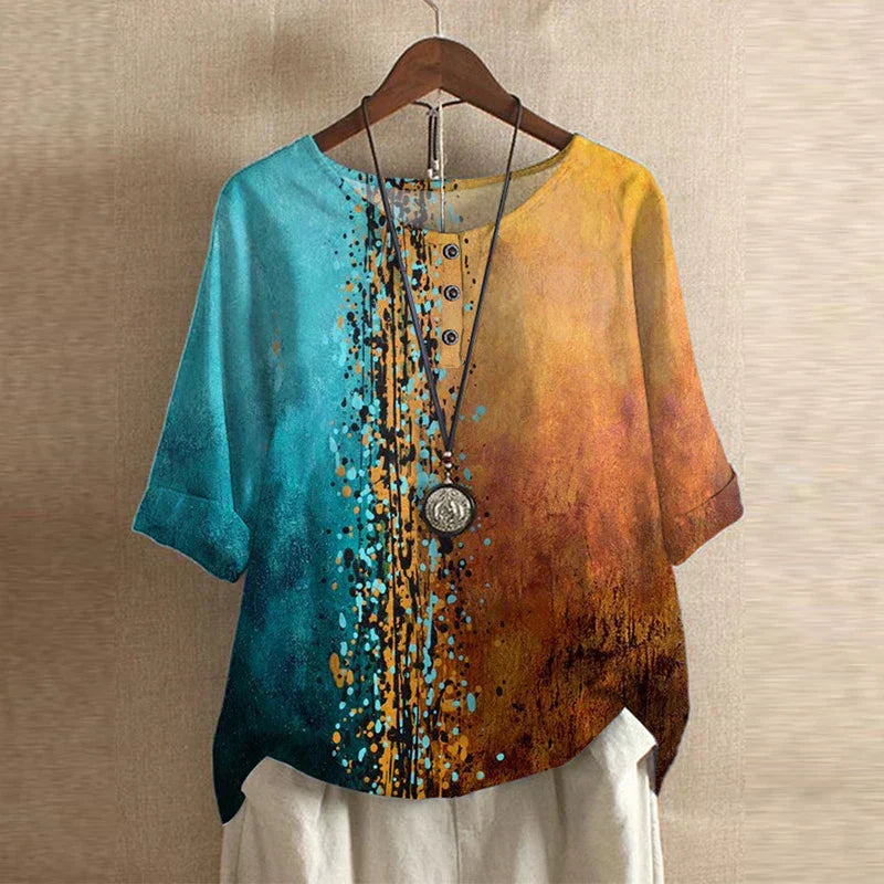 A vintage-inspired floral top on a plain background.