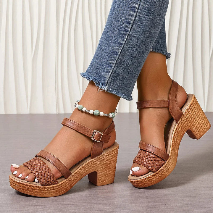 Woman styled in textured platform sandals for warm-weather outfits.