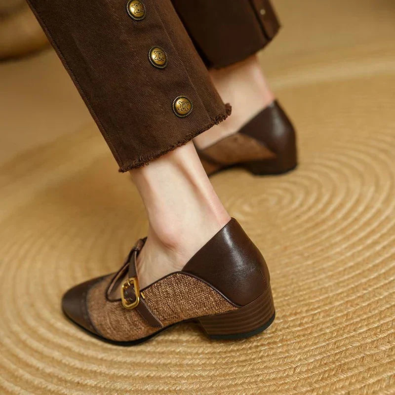Female model displaying low heel Mary Jane shoes with a refined everyday look.