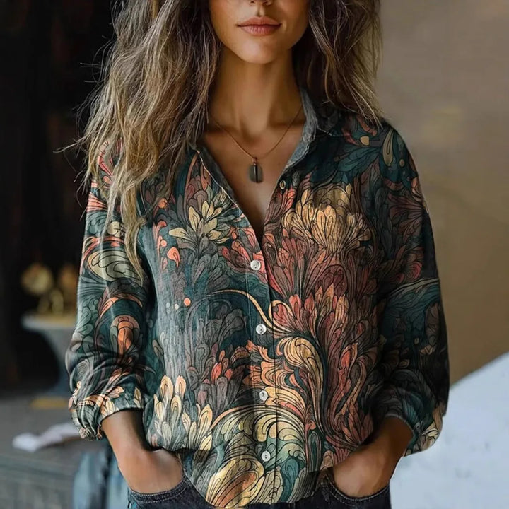  Woman wearing a patterned button-front shirt with long sleeves.