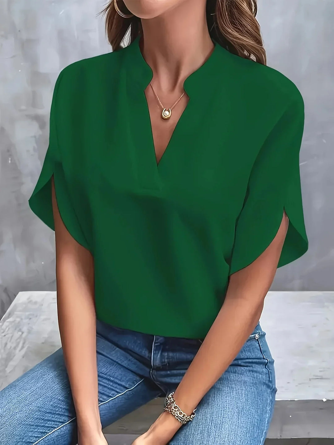  Woman wearing a versatile blouse suitable for everyday styling.
