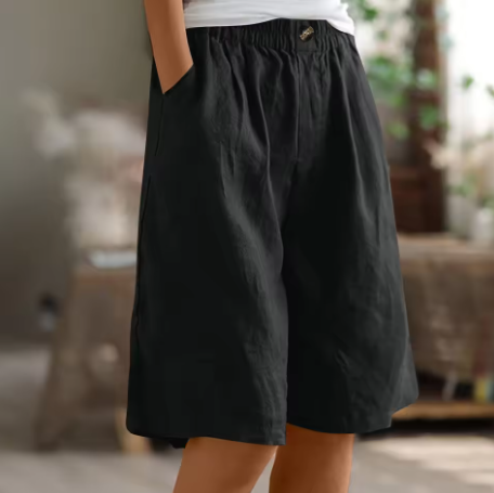 Casual daily shorts with pull-on waistband on a plain background.