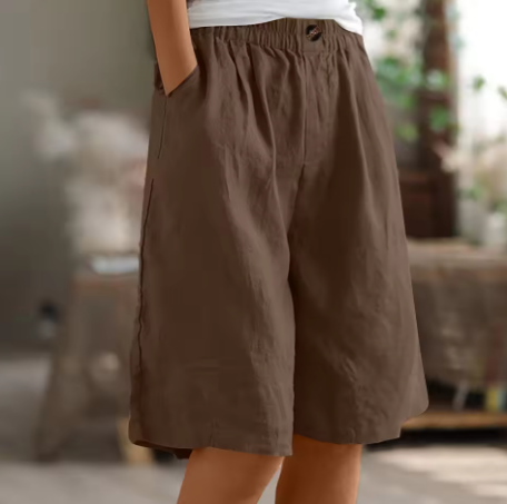 Simple relaxed shorts for casual outfits on a plain background.