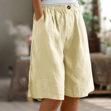 Women’s warm weather shorts with flexible waistband on a plain background.