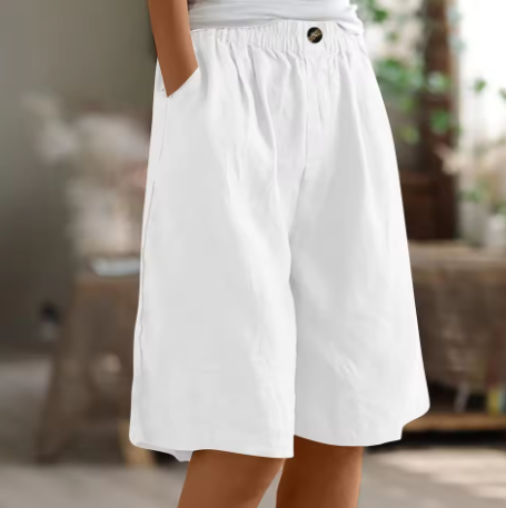 Women’s laid-back shorts for warm days on a plain background.