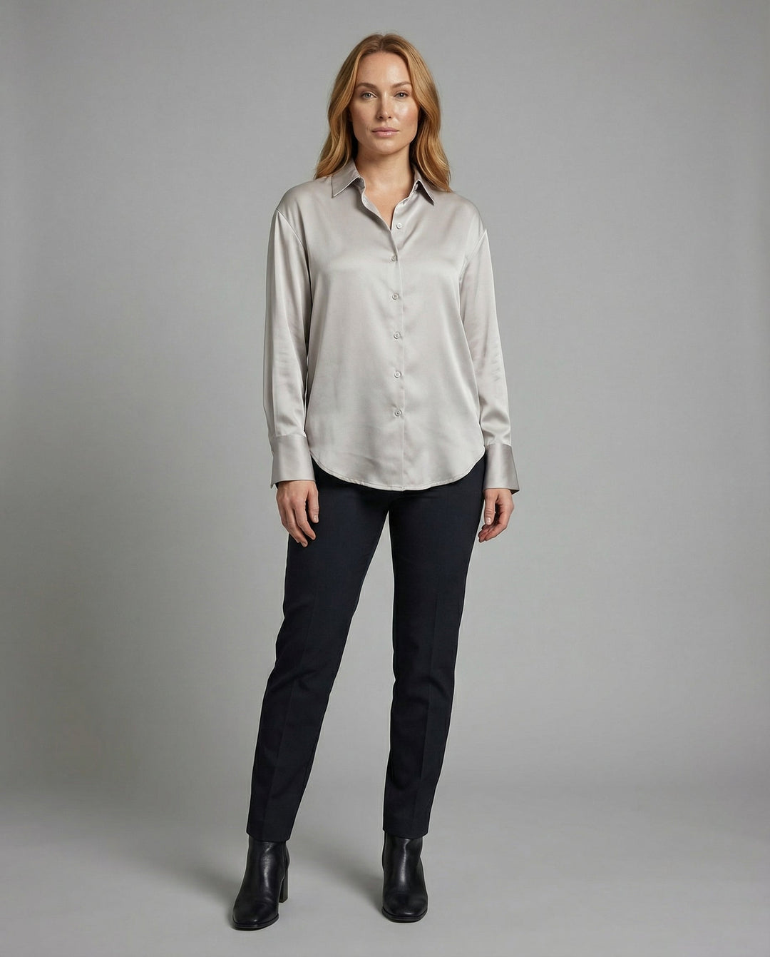 Female modelling a smooth silk blouse with an elegant relaxed fit.