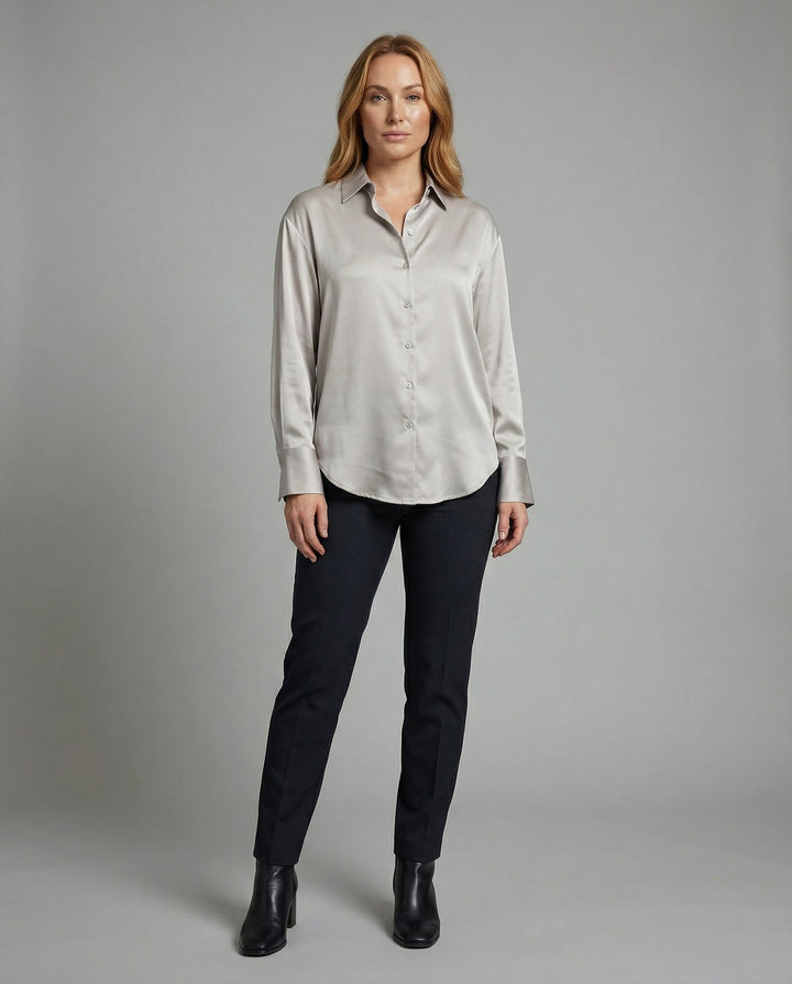 Female modelling a smooth silk blouse with an elegant relaxed fit.