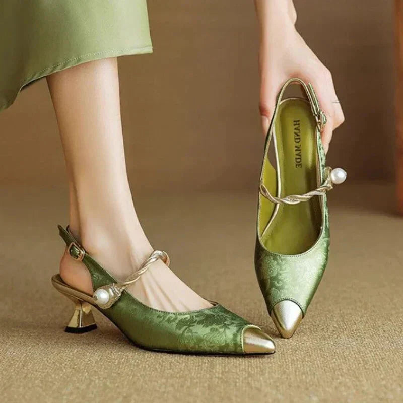 Floral textured slingback heel with pearl strap detail on a plain background.