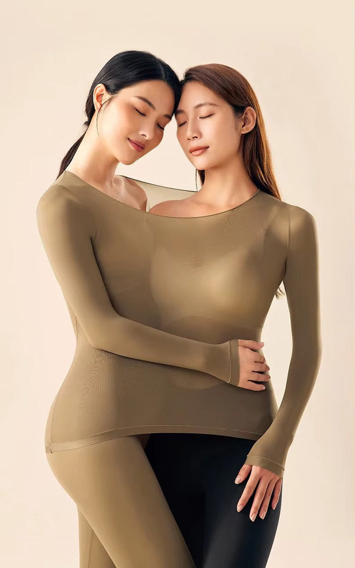 Woman in a figure-hugging thermal outfit designed for cold-weather layering.