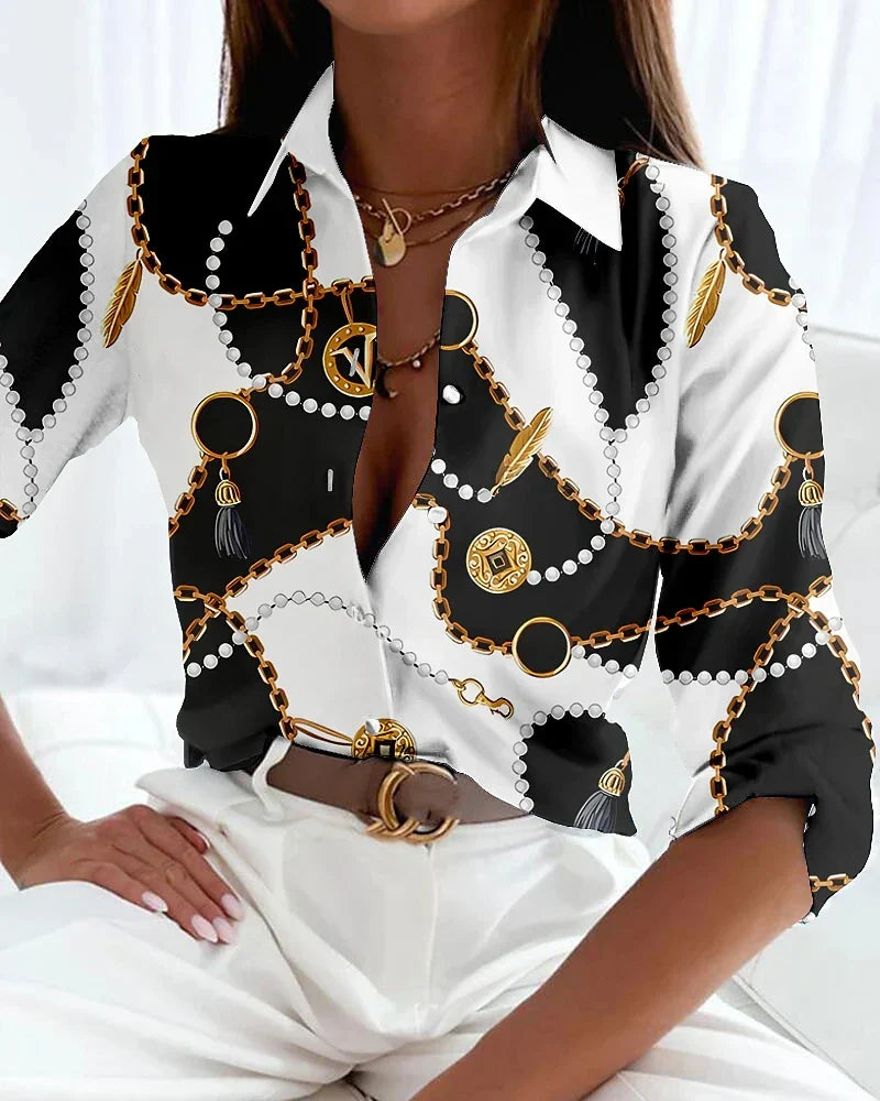  Female wearing a stylish printed blouse with a relaxed silhouette.