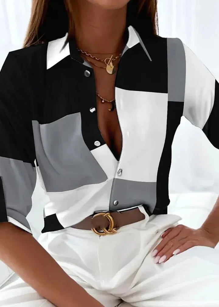  Female modelling a contemporary printed blouse with a flattering fit.