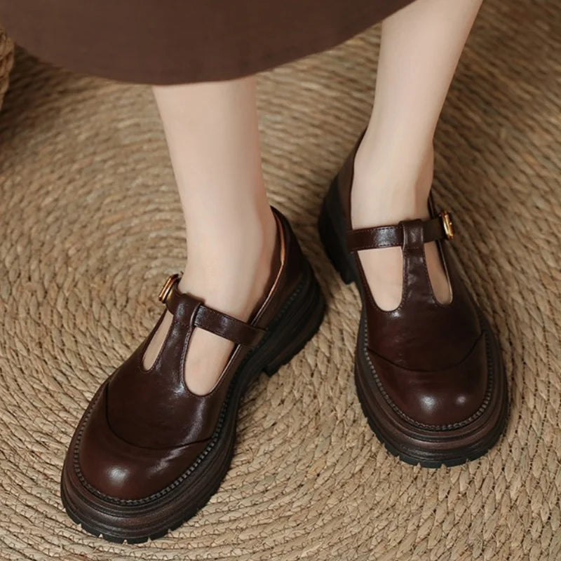 Female slip-on pointed toe heels with a mid-height block heel on a plain background.