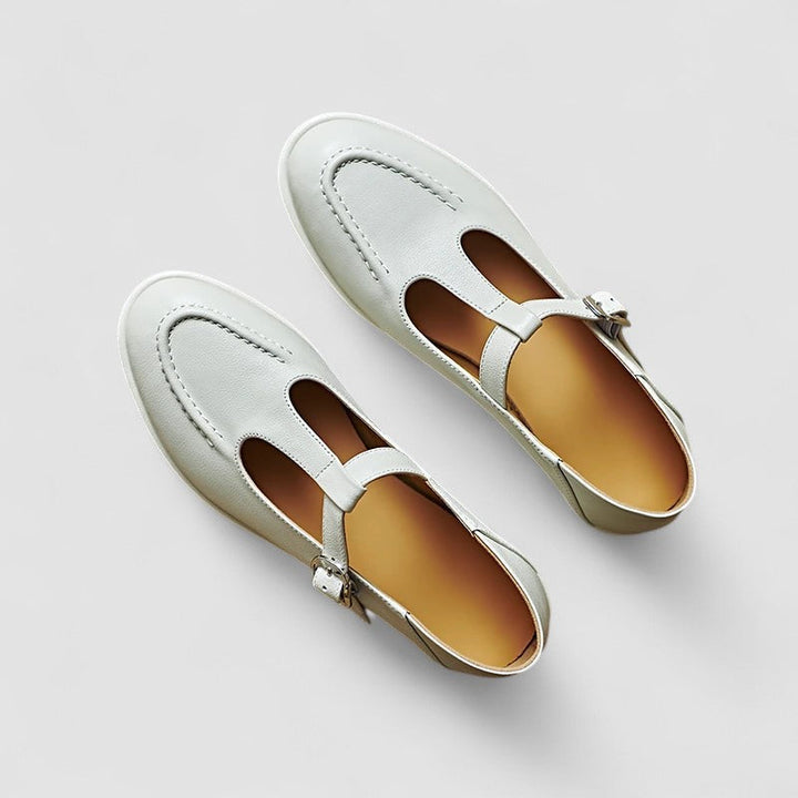 Low heel shoes on a plain background.