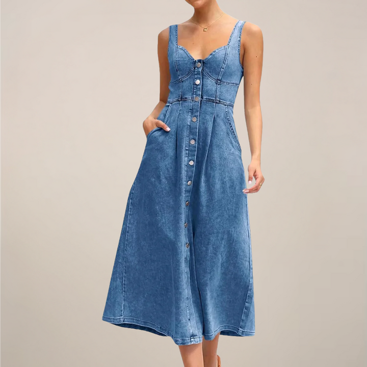 Female model wearing a sleeveless button front midi dress on a plain background.