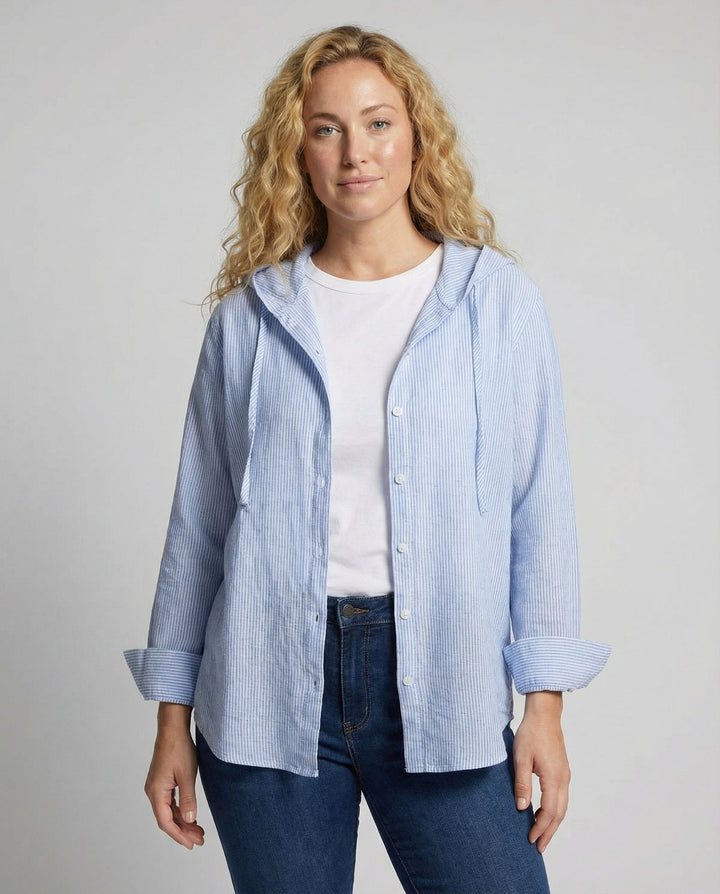 Woman wearing a lightweight blouse against a plain background.