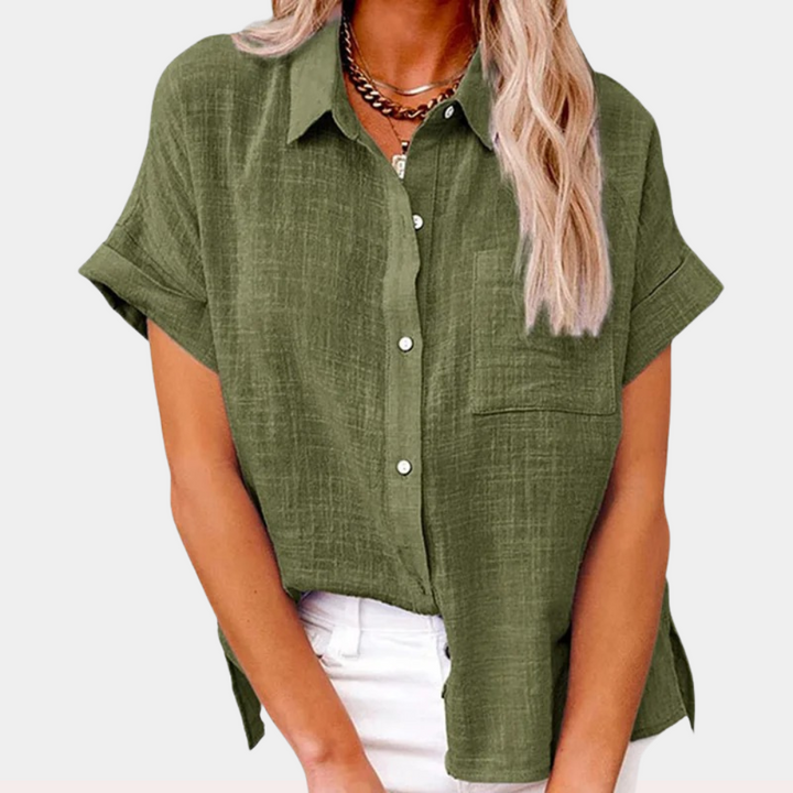  Female modelling a lightweight striped blouse with long sleeves on a plain background.