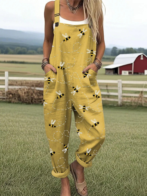 Female model wearing an embroidered jumpsuit on a ranch background.