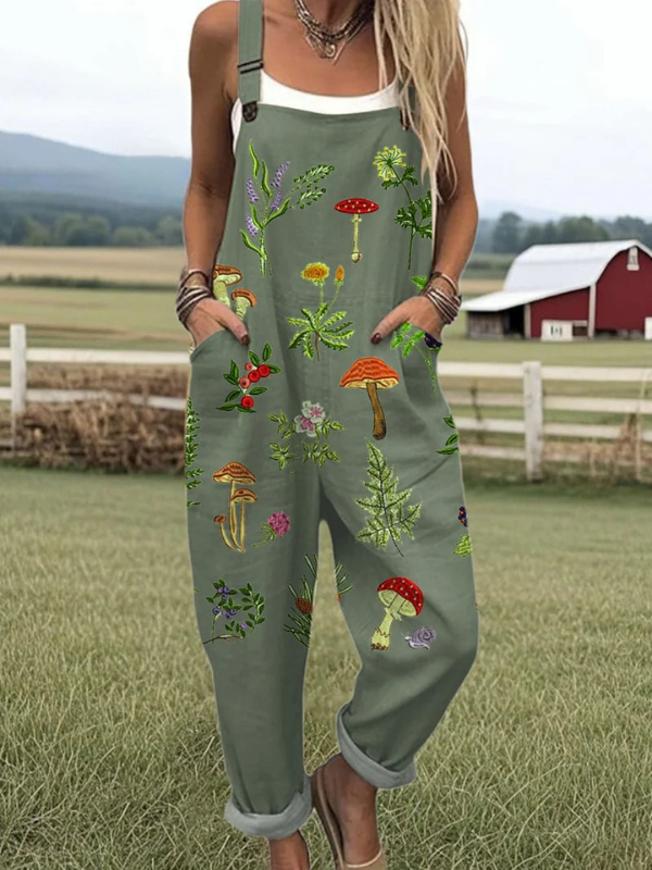 Model wearing a relaxed bee motif jumpsuit against a nature background.