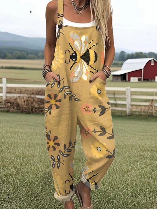 Model wearing a vivid floral print jumpsuit with a plain background.