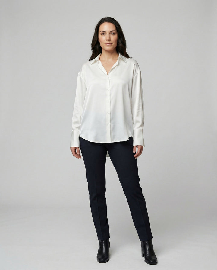 Female modelling an elegant silk blouse with a classic silhouette.