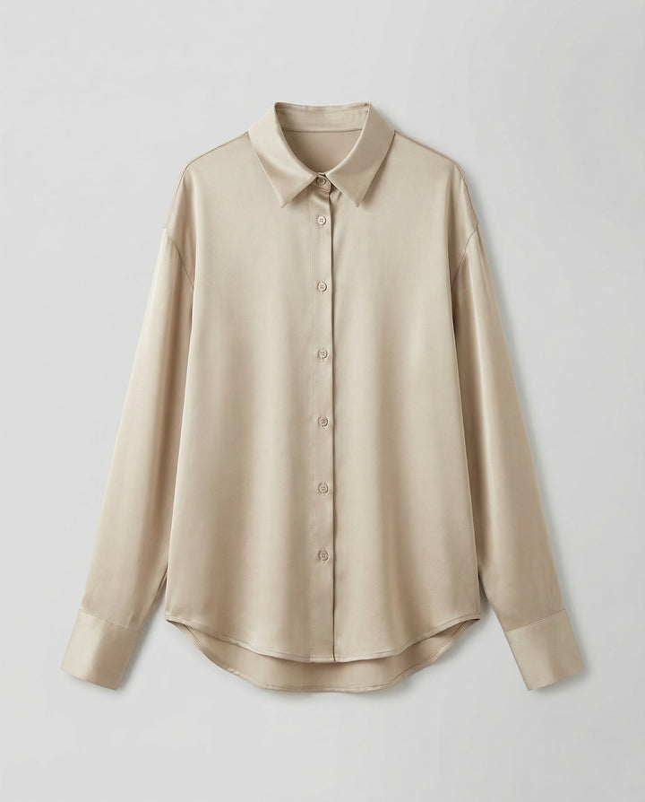 Elegant silk blouse paired with a clean plain background.