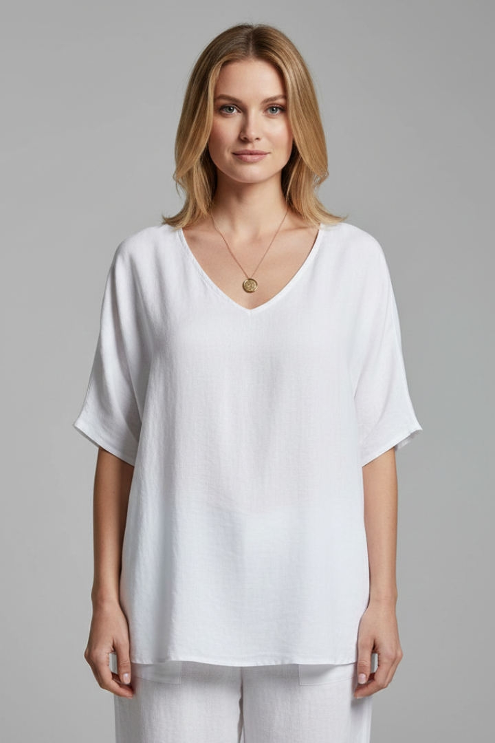Woman wearing a lightweight casual blouse in a studio setting