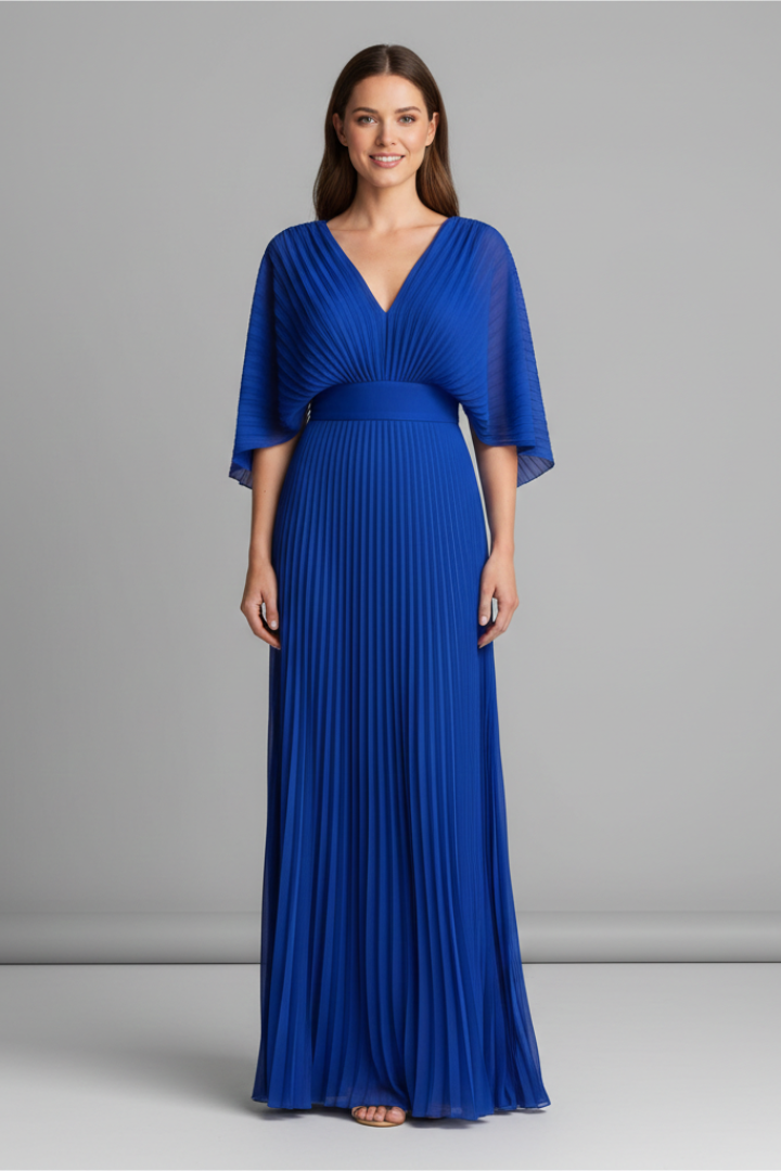 Female model wearing a long dress with a V-shaped neckline and pleated skirt on a plain background.