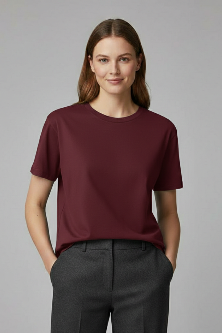 Women’s roomy daily wear T-shirt with short sleeves on a plain background.