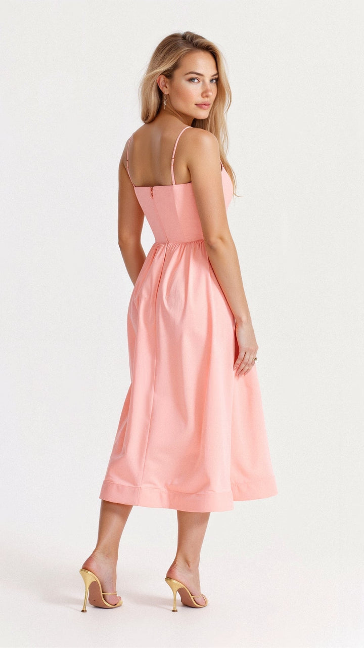 Woman wearing a flowing midi dress designed for warm-weather styling.
Female modelling a re