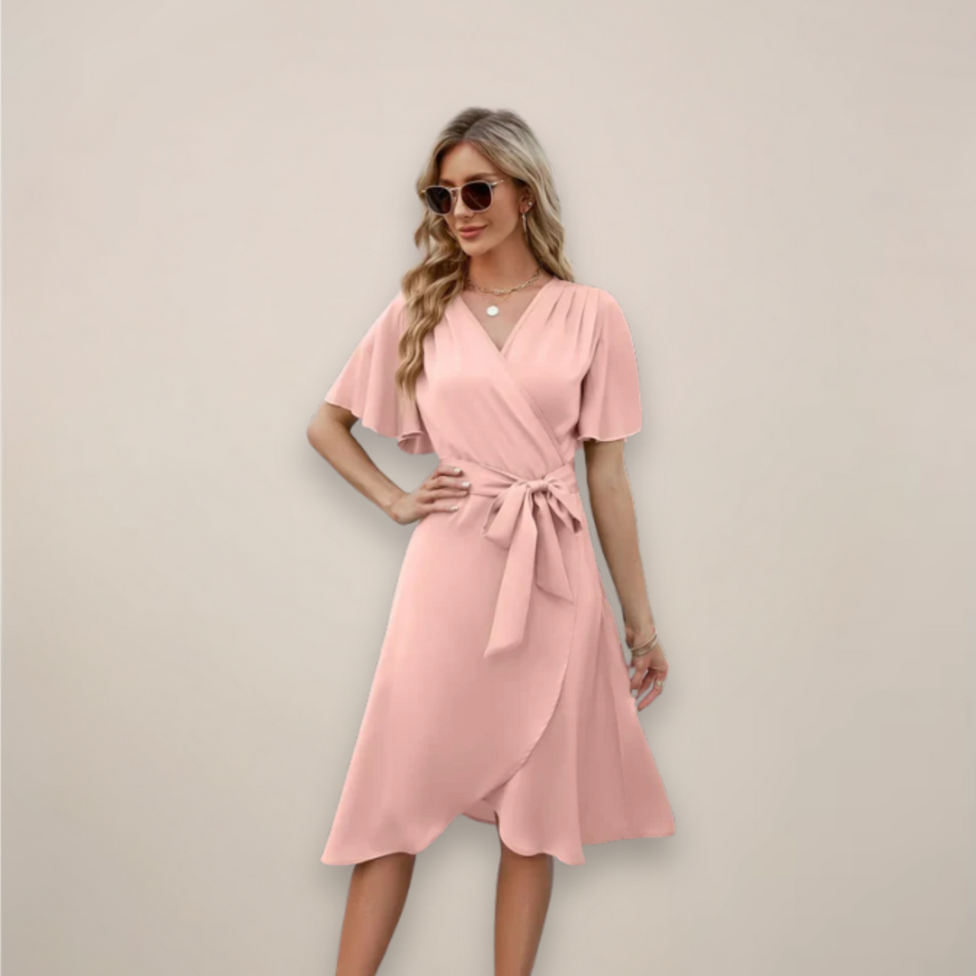 Female modelling a V-neck midi wrap dress with short sleeves.