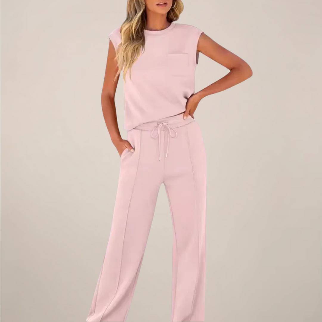 Model wearing a drawstring waist pants set with a clean casual look on a plain background.