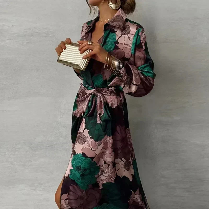 Female model wearing a dark green floral maxi shirt dress with long sleeves on a plain background.