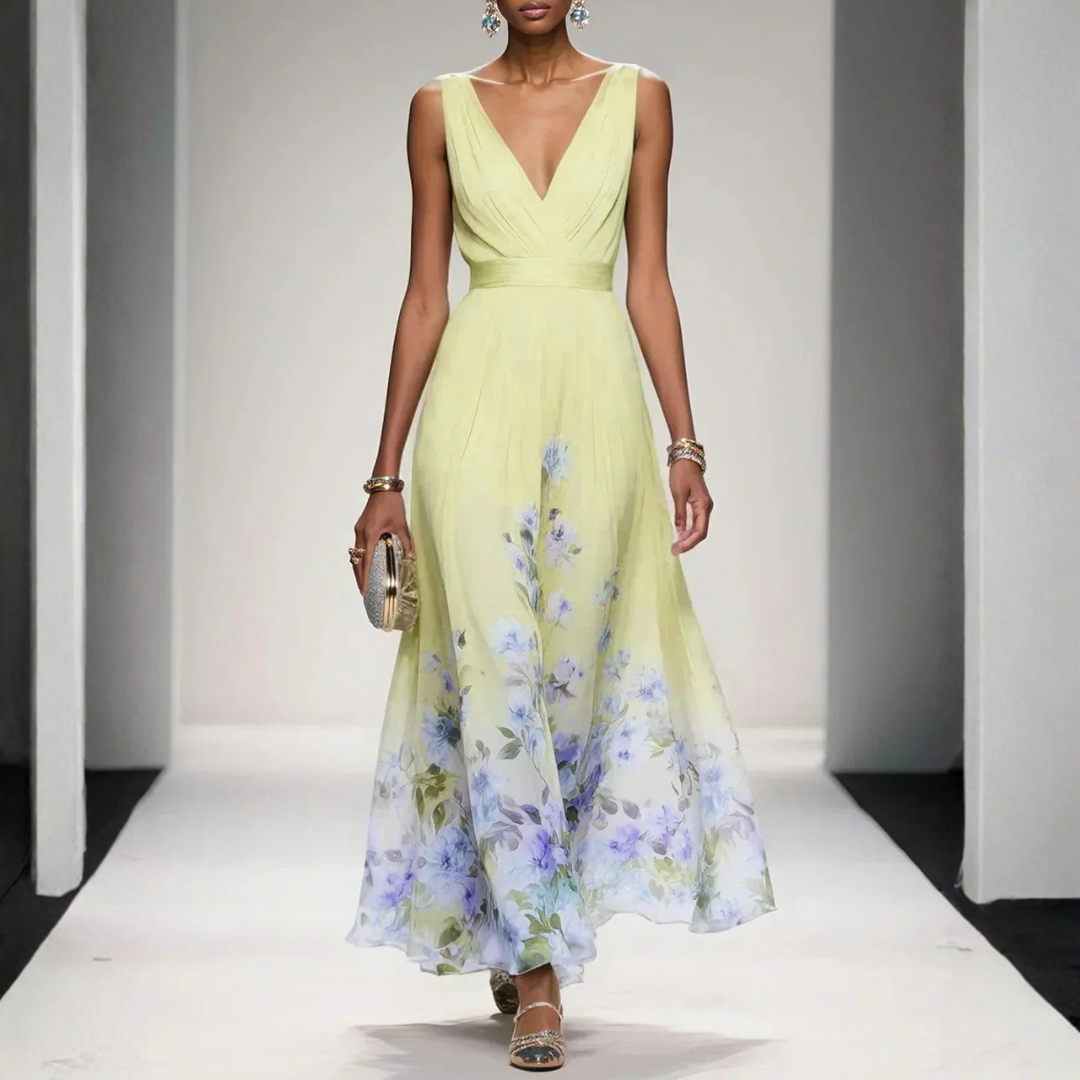 Woman posing in a V-neck floral maxi dress with ruched detailing against a plain background.