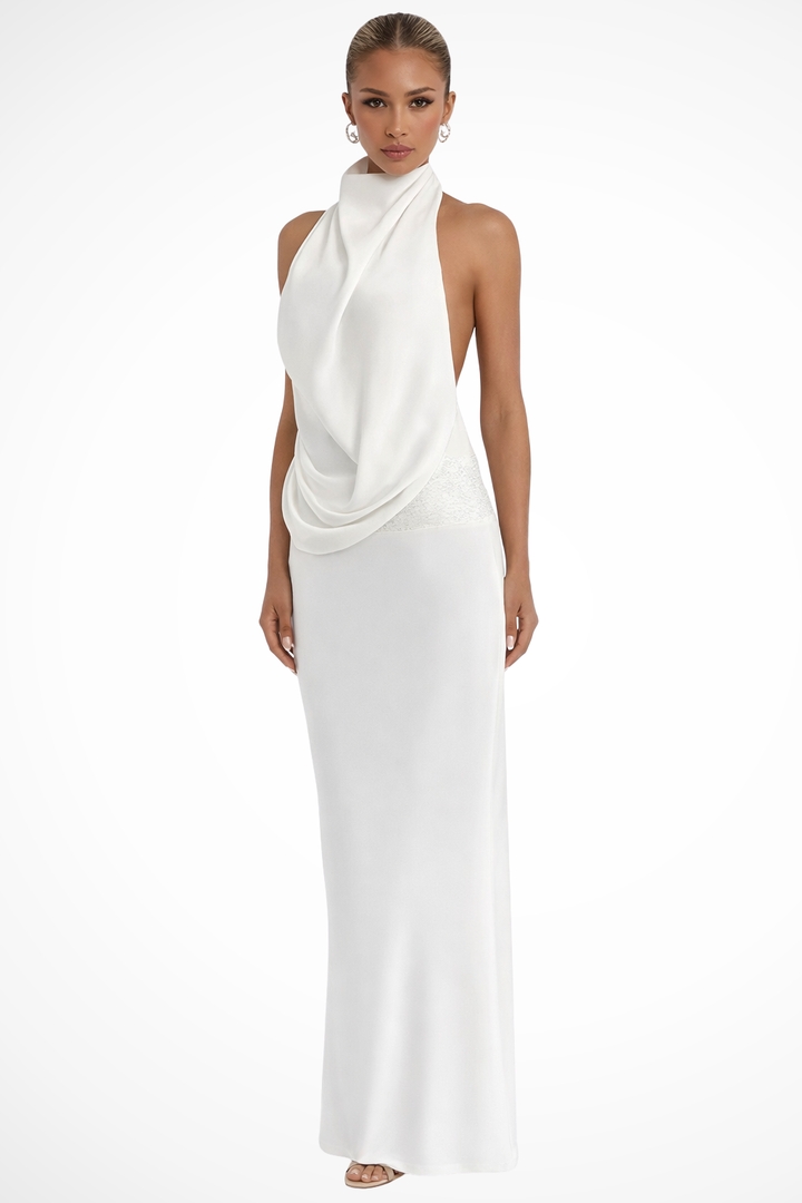 Model wearing a floor-length satin dress with halter neck on a plain background.
