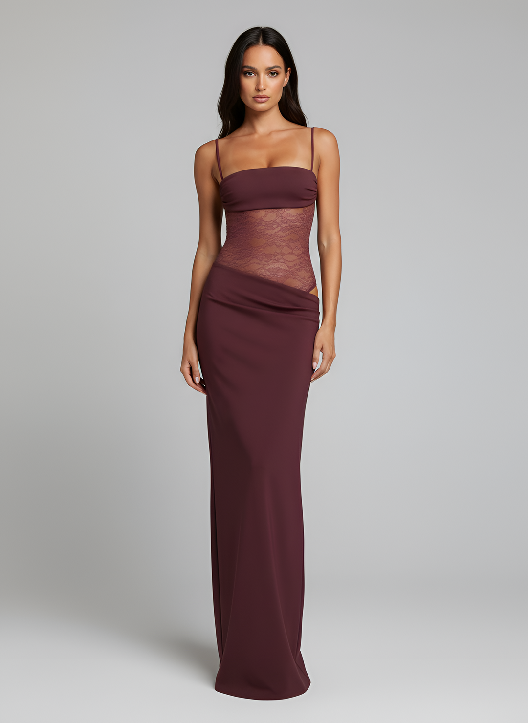 Female wearing a lace detail maxi dress with tie straps on a plain background.